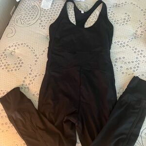 Free People movement Black Racerback Jumpsuit with V-Neck and Full-Length Legs